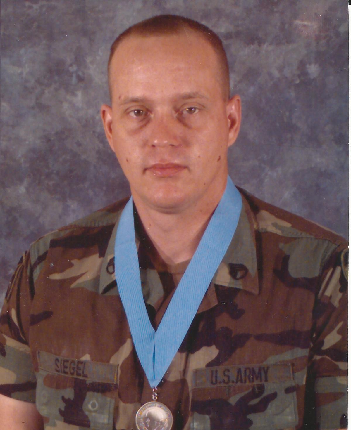 Michael being inducted into the SGT Audie Murphy Club.